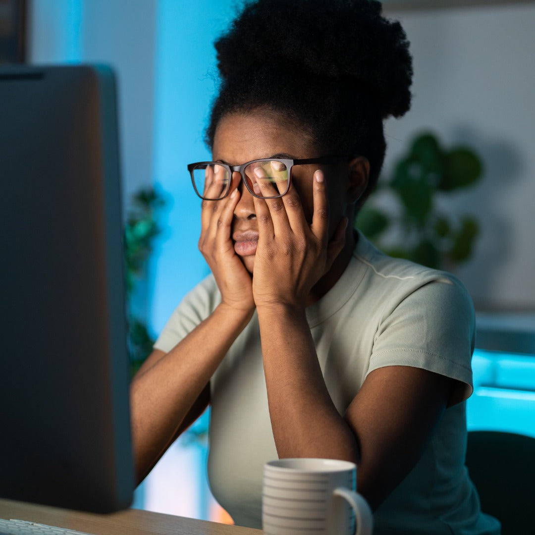Woman hitting the 3pm crash that vitamins for energy and fatigue supplements address